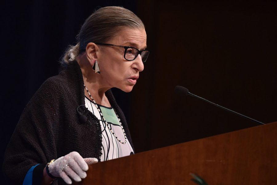n this Oct. 21, 2019, file photo, U.S. Supreme Court Justice Ruth Bader Ginsburg gestures while speaking at the University of California at Berkeley, in Berkeley, Calif. The Supreme Court says Ginsburg has been hospitalized after experiencing chills and fever. 