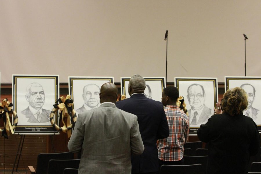 President Quinton T. Ross and others, stand to honor former University Presidents,