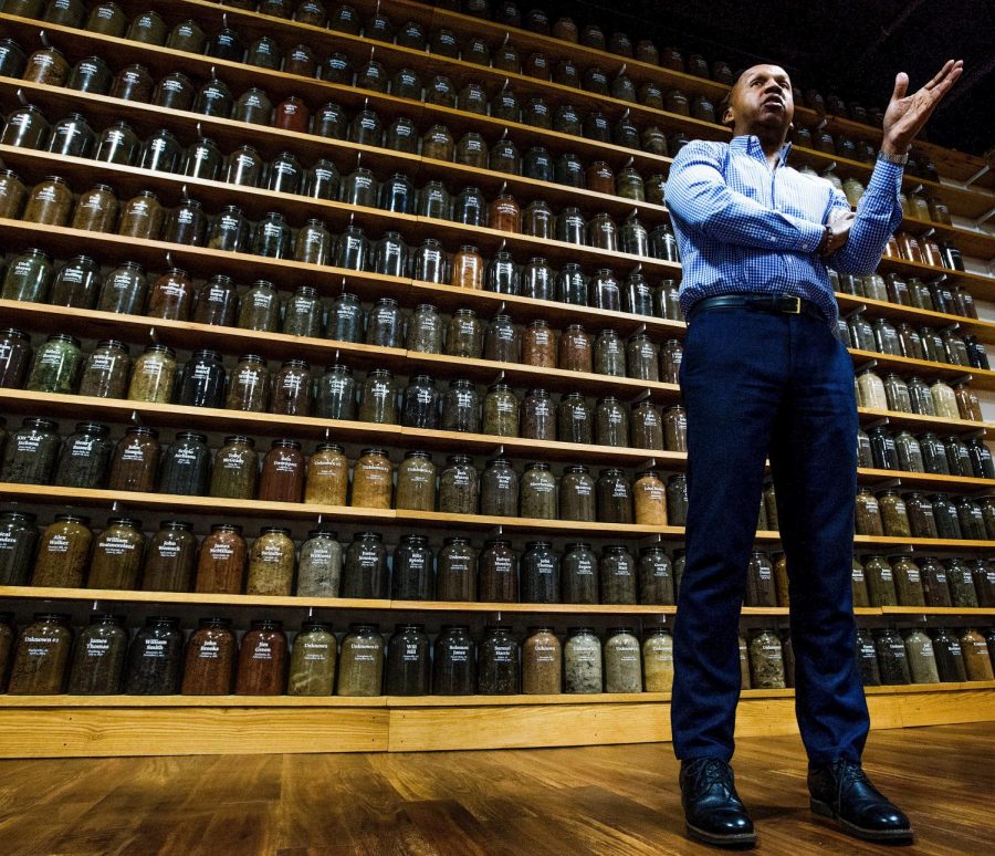 Bryan Stevenson, Executive Director of the Equal Justice Initiative, is shown standing before jars containing soil from the sites of confirmed lynchings in the state of Alabama as he discusses the opening of the Legacy Museum and the National Memorial for Peace and Justice at the EJI offices in Montgomery, Ala. on Friday April 13, 2018. 