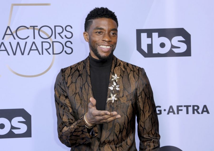 FILE - In this Jan. 27, 2019 file photo, Chadwick Boseman arrives at the 25th annual Screen Actors Guild Awards at the Shrine Auditorium & Expo Hall in Los Angeles. Boseman, who played Black icons Jackie Robinson and James Brown before finding fame as the regal Black Panther in the Marvel cinematic universe, has died of cancer. His representative says Boseman died Friday, Aug. 28, 2020 in Los Angeles after a four-year battle with colon cancer. He was 43. (Photo by Willy Sanjuan/Invision/AP, File)