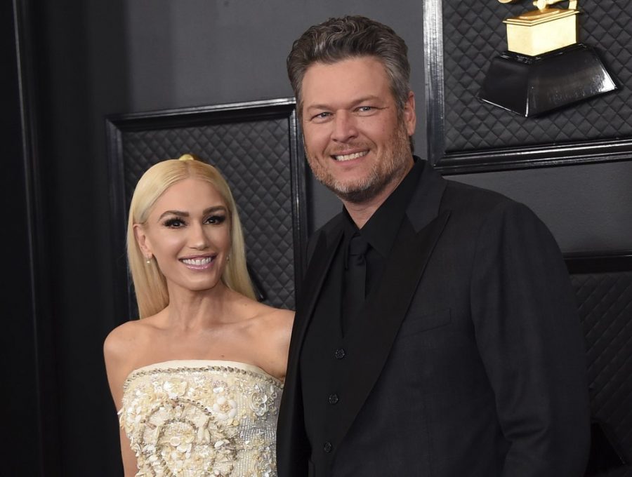 FILE - Gwen Stefani, left, and Blake Shelton arrive at the 62nd annual Grammy Awards in Los Angeles on Jan. 26, 2020. Shelton and Stefani posted a picture on Tuesday announcing their engagement.A representative for Shelton confirmed the couple recently got engaged while in Oklahoma, where Shelton lives. The two stars met as judges on the singing competition show years ago. (Photo by Jordan Strauss/Invision/AP, File)