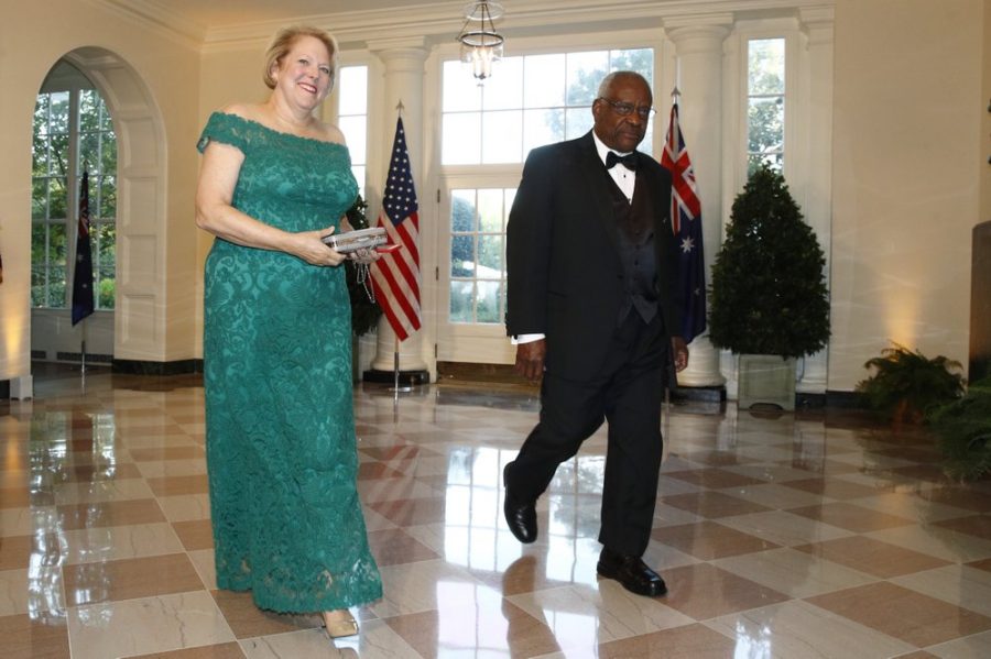 In this Sept. 20, 2019, file photo, Supreme Court Associate Justice Clarence Thomas, right, and wife Virginia Ginni Thomas arrive for a State Dinner with Australian Prime Minister Scott Morrison and President Donald Trump at the White House in Washington. Ginni Thomas is using her Facebook page to amplify unsubstantiated claims of corruption by Joe Biden. She is a longtime conservative activist who asked her more than 10,000 followers Oct. 26, 2020, to consider sharing a link focused on alleged corruption by Biden and his son, Hunter, as well as claims that social media companies are censoring reports about the Bidens. (AP Photo/Patrick Semansky, File)