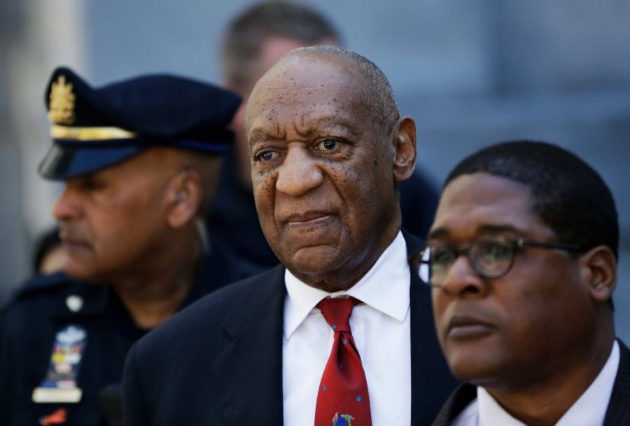 FILE - In this April 26, 2018 file photo, Bill Cosby, center, leaves the the Montgomery County Courthouse in Norristown, Pa., after being convicted of drugging and molesting a woman. The actor has spent more than two years in prison since he was convicted of sexual assault in the first celebrity trial of the #MeToo era. Now the Pennsylvania Supreme Court is set to hear his appeal of the conviction on Tuesday, Dec. 1, 2020. The arguments will focus on the trial judges decision to let five other accusers testify for the prosecution. (AP Photo/Matt Slocum, File)