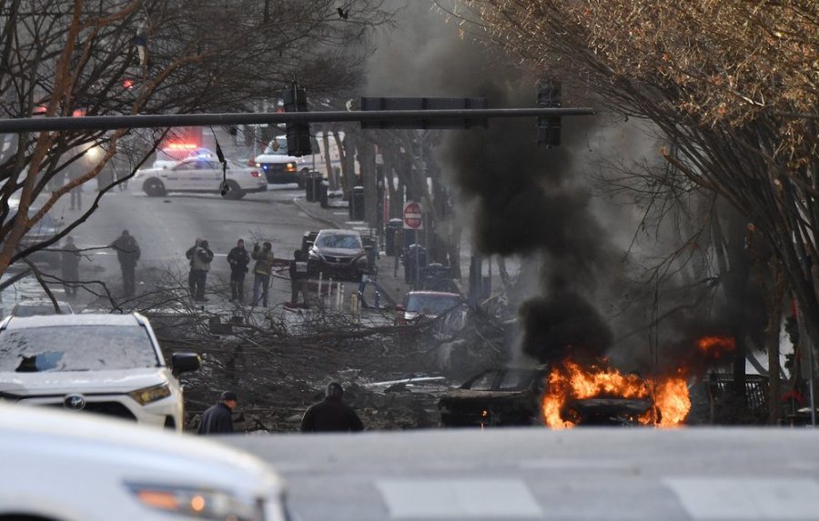 A vehicle is on fire after an explosion in the area of Second and Commerce Friday, Dec. 25, 2020 in Nashville, Tenn. Buildings shook in the immediate area and beyond after a loud boom was heard early Christmas morning. (Andrew Nelles/The Tennessean via AP)