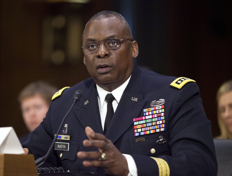 FILE - In this Sept. 16, 2015, photo, U.S. Central Command Commander Gen. Lloyd Austin III, testifies on Capitol Hill in Washington. Biden will nominate retired four-star Army general Lloyd J. Austin to be secretary of defense. Thats according to three people familiar with the decision who spoke on condition of anonymity because the selection hadnt been formally announced. (AP Photo/Pablo Martinez Monsivais, File)