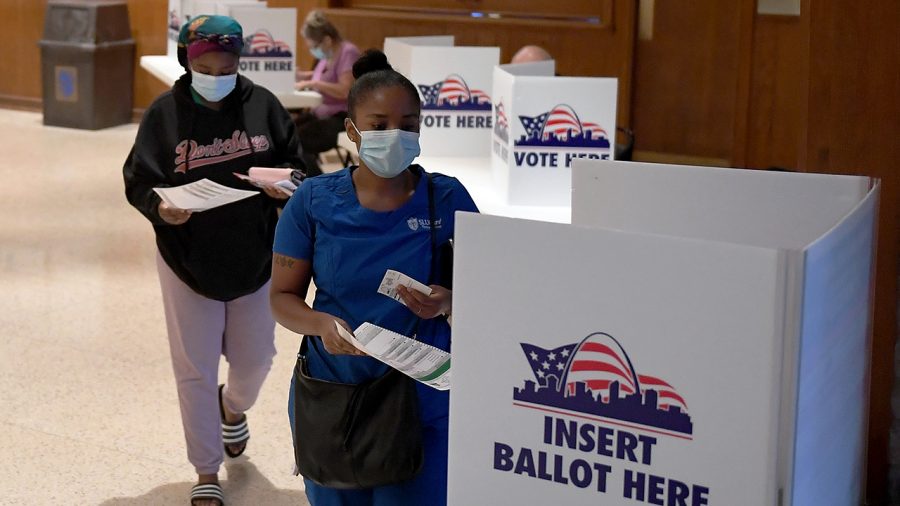 ST LOUIS, MO - AUGUST 04: Voters cast their ballots in Missouris primary election at Gambrinus Hall in St Louis, Missouri.   Voters will see a host of changes because of the COVID 19 pandemic including less polling places but bigger locations to help with social distancing. (Photo by Michael B. Thomas/Getty Images)