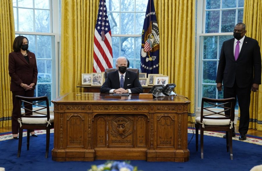 President Joe Biden meets with Secretary of Defense Lloyd Austin, Vice President Kamala Harris, in the Oval Office of the White House, Monday, Jan. 25, 2021, in Washington. (AP Photo/Evan Vucci)