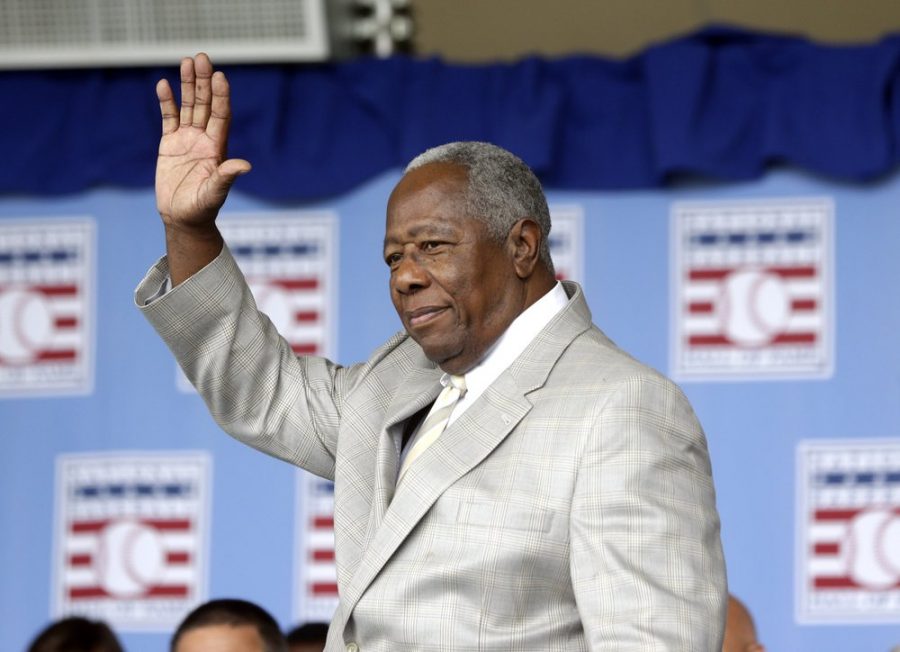 Hall of Famer Hank Aaron waves to the crowd during Baseball Hall of Fame induction ceremonies in Cooperstown, N.Y., in this Sunday, July 28, 2013, file photo. Hank Aaron, who endured racist threats with stoic dignity during his pursuit of Babe Ruth but went on to break the career home run record in the pre-steroids era, died early Friday, Jan. 22, 2021. He was 86. The Atlanta Braves said Aaron died peacefully in his sleep. No cause of death was given. (AP Photo/Mike Groll, File)

