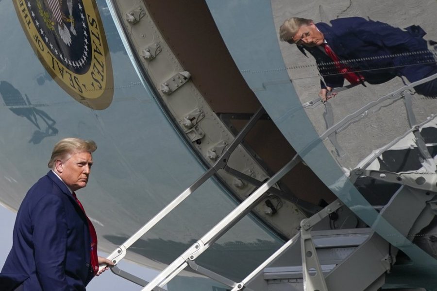 In this Dec. 31, 2020, file photo President Donald Trump boards Air Force One at Palm Beach International Airport in West Palm Beach, Fla. (AP Photo/Patrick Semansky, File)