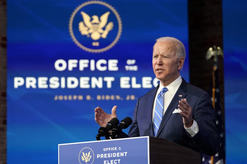 President-elect Joe Biden speaks about the COVID-19 pandemic during an event at The Queen theater, Thursday, Jan. 14, 2021, in Wilmington, Del., as Vice President-elect Kamala Harris listens. (AP Photo/Matt Slocum)