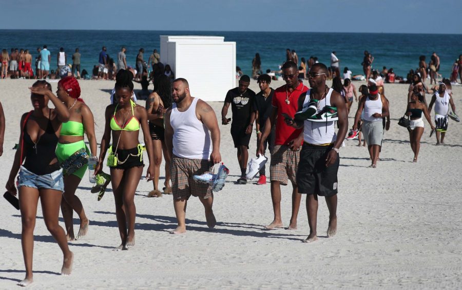 Beachgoers leave South Beach on Sunday, March 15, 2020.   With four deaths, Florida was already on the front lines of the coronavirus crisis (Joe Raedle/Getty Images via CNN).