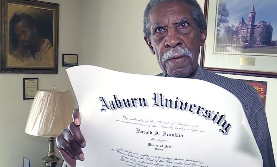 Harold A. Franklin displays his master of arts diploma that he received from Auburn University after waiting for 54 years.