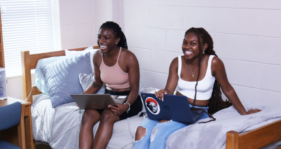 Many first-year students make the choice to reside on campus, as it allows them a more convenient way of living. Pictured are freshmen Kamiya and Chelsea as they bond in their C.J. Dunn Tower.