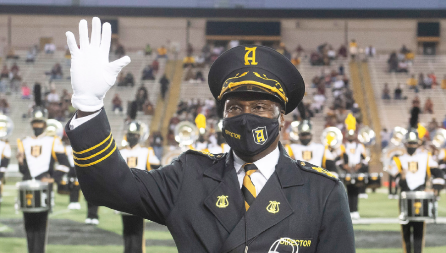 After 20 years of serving as the band director for Alabama State University, James B. Oliver, Ed.D., waves to the crowd as they express their appreciation for the impact that he has made with hundreds of students since returning to his alma mater to lead the band.