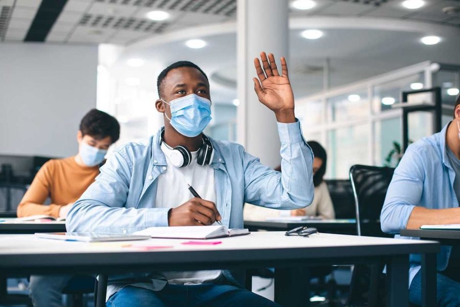 Students wearing masks have almost become the norm for college students as the virus has mutated into a number of variants.