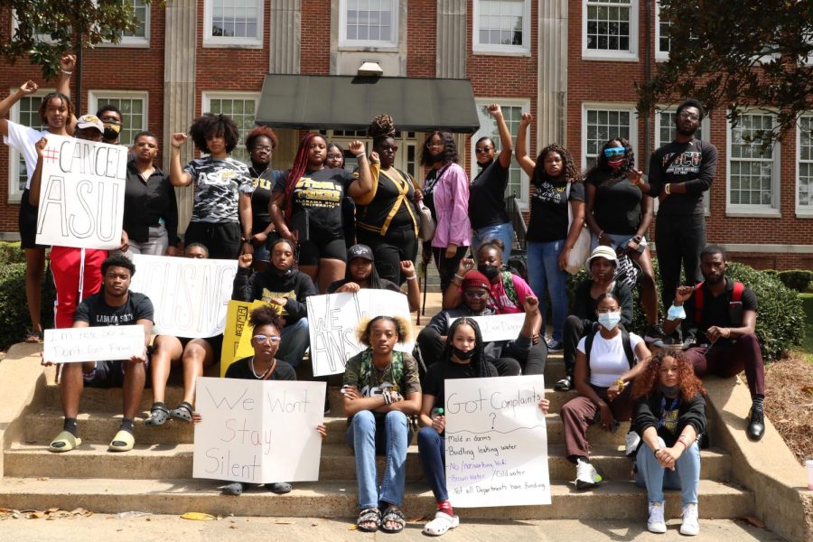 Students sit quietly in front of William Hooper Councill Hall in an organized protest regarding their living conditions and the amount of the disbursements distributed from the American Rescue Plan Act.