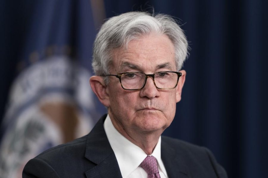 Fed raises key rate by a half point in bid to tame inflation