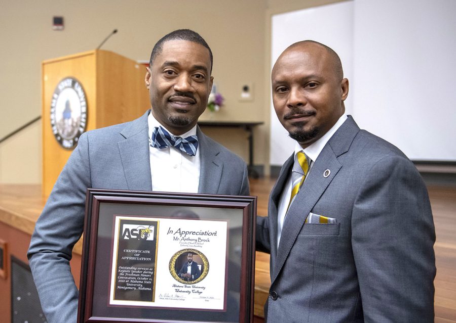 Provost and Vice President of Academic Affairs Carl Pettis, Ph.D., takes a moment to pose with Anthony Brock after University College officials awarded Brock a certificate of appreciation for serving as the featured speaker. 