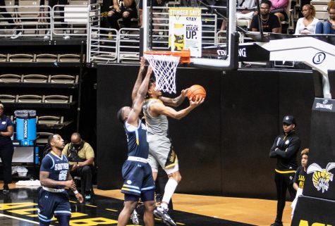 Rising up over the out stretched hands of a Grambling State University Tiger defender, Hornet junior forward Duane Posey attempts a layup after penetrating the paint.