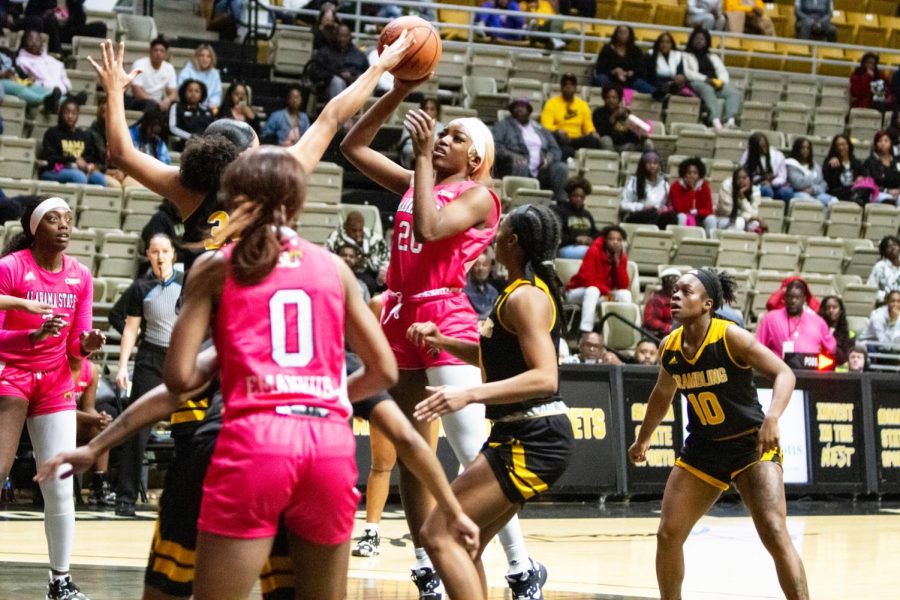 During the matchup between the Alabama State University Hornets and the Grambling State University Tigers, Hornet junior forward Cordasia Harris nails a floater in the midst of three Tiger defenders.