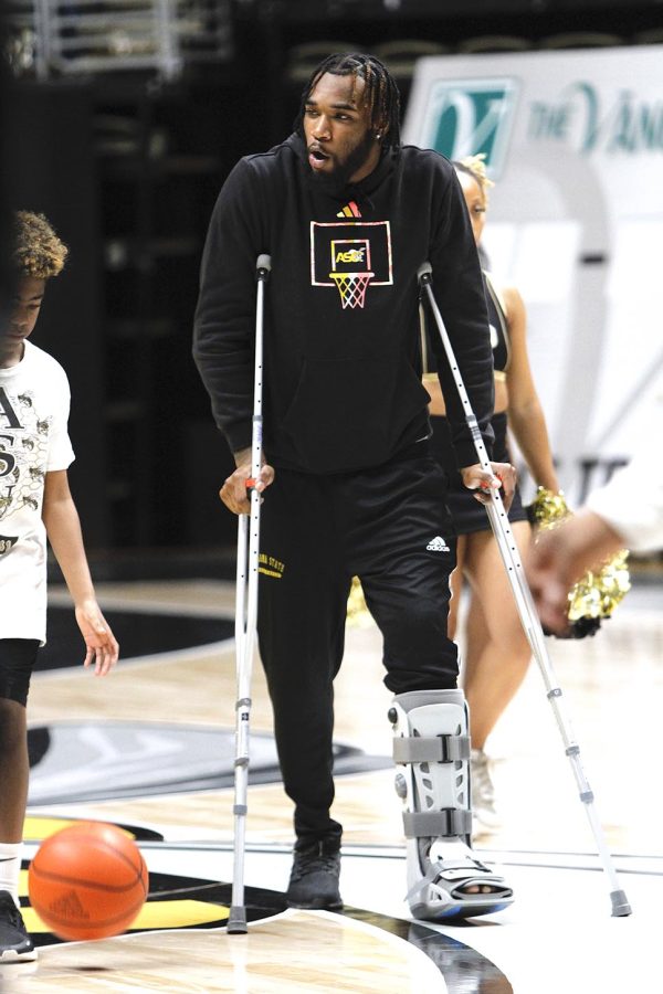 After his hospital stay, medical personnel placed a boot on Isaiah Range leg and gave him crutches.