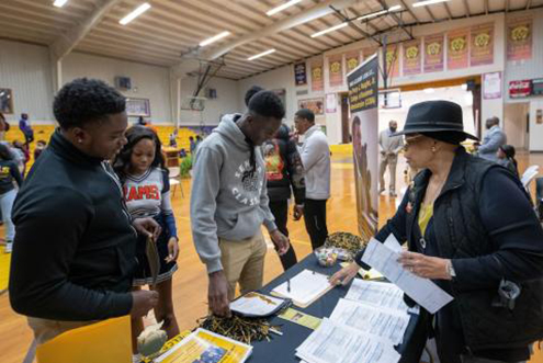 During the President’s Bus Tour, a stop was made in Uniontown, Alabama to visit the students of Robert C. Hatch High School.  Pictured above are students checking out the College of Business Administration table and the various majors offered.