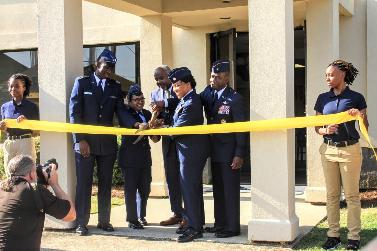 Members of the AFROTC, Lt. Col. Lisa Boyer, President Quinton T. Ross Jr., Ed.D. cut the ribbon to their new facility located on the corner of 300 Carter Hill Road.