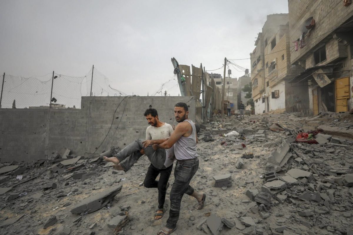 Palestinians evacuate wounded in Israeli aerial bombing on Jabaliya, near Gaza City, Wednesday, Oct.11, 2023 (AP Photo/Mohammad Al Masri)