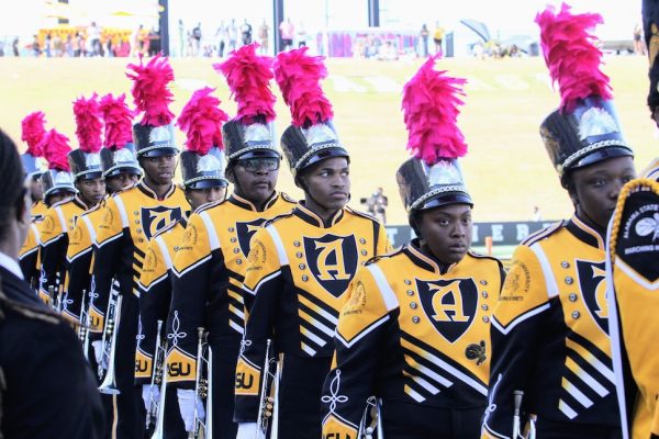 Members of the Mighty Marching Hornets file into the ASU stadium as they prepare to entertain the audience during the Hornets vs. Alcorn State University Braves football game. 