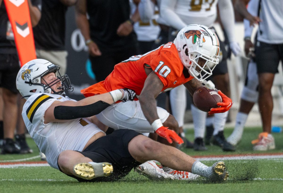 Alabama State University Hornets linebacker Colton Adams attempts to tackle Florida Agricultural and Mechanical Rattlers Jah’Marae Sheread during the football game.