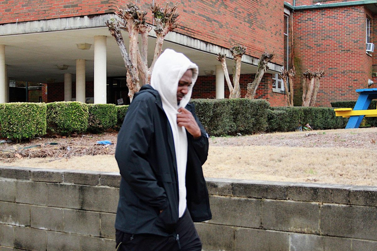 This student is well bundled up as the wind sweeps across the campus causing record cold temperatures.