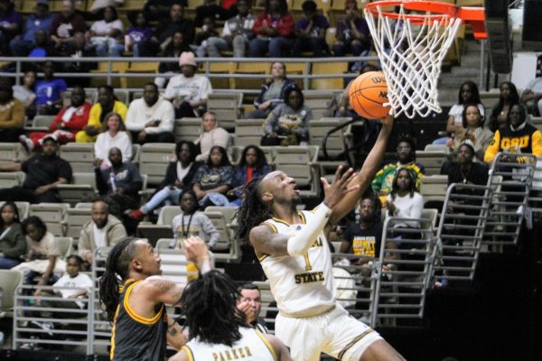 Alabama State University Hornet guard Amarr Knox drives to the basket for a lay-up during the final regular season game against the Grambling State University Tigers in the Dunn-Oliver Acadome.
