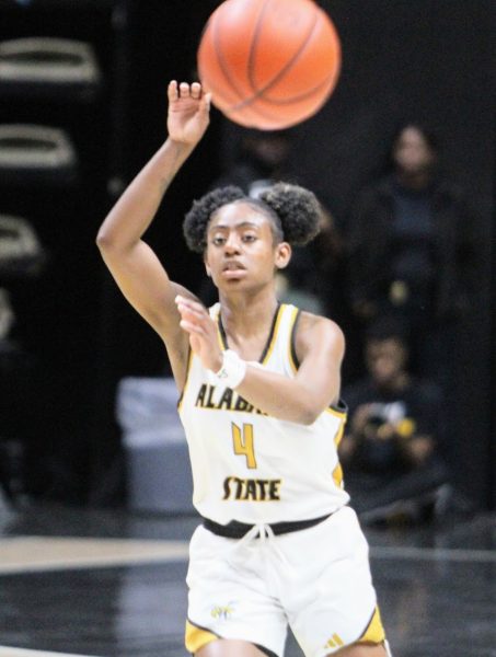 Alabama State University Lady Hornet guard DaKiyah Sanders passes the ball out of the backcourt in a game against the Grambling State University Tigers. 