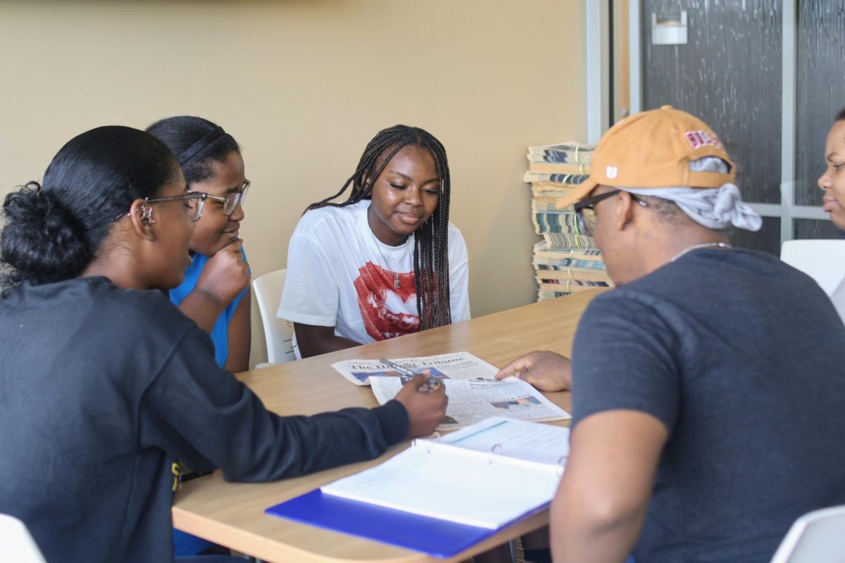 Editor-in-Chief Ashonti Shaw explains her vision and goals regarding newspaper design and student engagement to managing editors Denise Ringo, James Stewart, Ambert Mitchell and first-year reporter/writer Kennedy Horton.