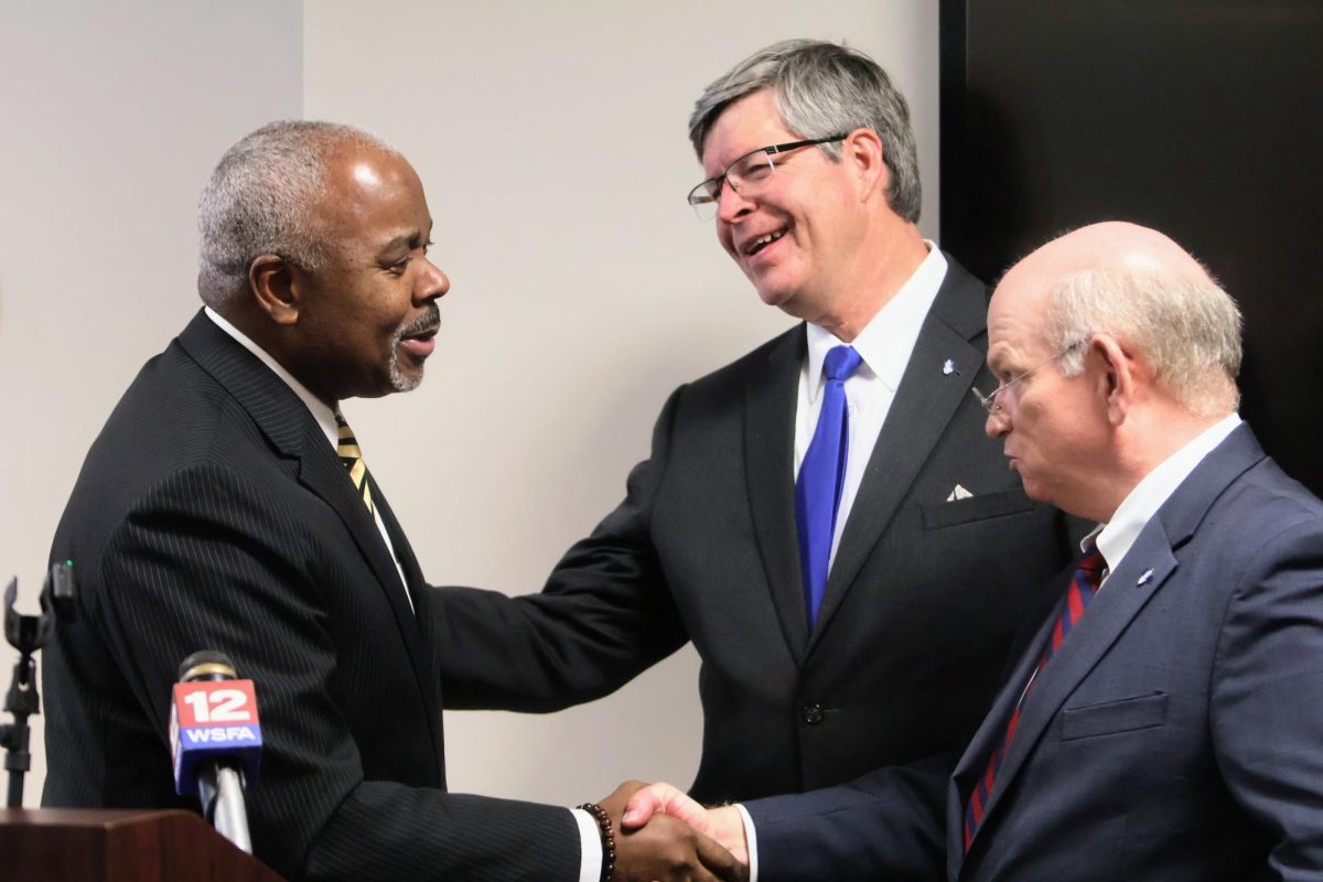 President Quinton T. Ross Jr., Ed.D., (left) shakes the hands of Faulkner University’s President Mitchell Henry, Ph.D. (middle) and the Thomas Goode Jones Law School Dean Charles B. Campbell, J.D., (right) after announcing their agreement for students to attend the law school after spending three years at the university.