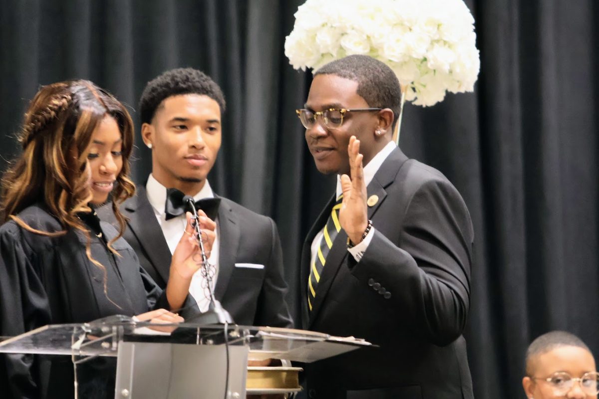 SGA Chief Justice Ashley Griffin formally swears in Dejuan Trottman as the 2024-25 Student Government Association Executive Treasurer.