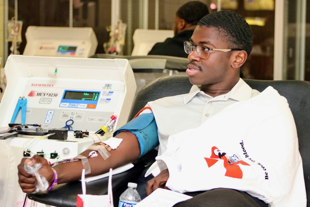 Clinton Chisholm selflessly donating blood to save lives at the blood drive.