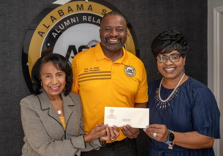 Senator Hatcher's check being presented by ASU's Col. (ret.) Gregory Clark (C) to Dean Franklin (L) and Dean Coleman (photo by David Campbell/ASU).