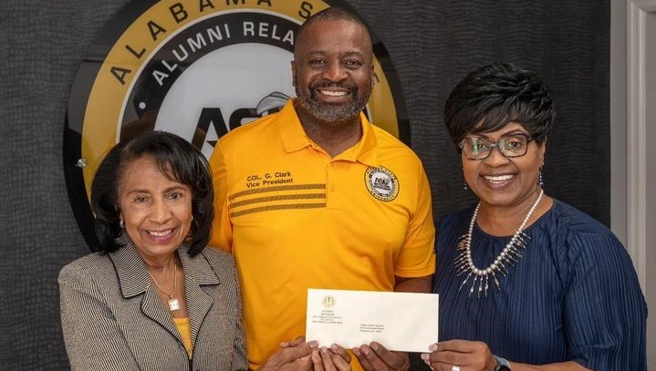 Col. (ret.) Gregory Clark, center, vice president for institutional advancement at Alabama State University, presents a check from state Sen. Kirk Hatcher to Dean Janice Franklin, left, of the National Center for the Study of Civil Rights and African American Culture, and Dean Wendy Coleman of the ASU College of Visual and Performing Arts. (David Campbell / ASU)