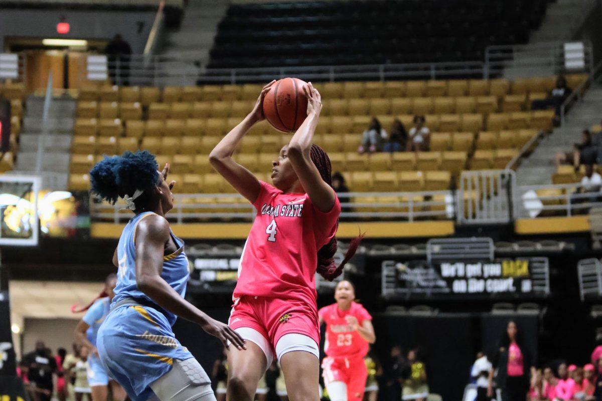 Alabama State University forward Kaitlyn Bryant looks to pass the ball while being guarded by Southern University guard DaKiyah Sanders. Bryant was the Hornets leading scorer, scoring 12 points and going 5-11 from the fiel